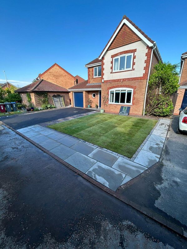 Completed front garden with new driveway, turfed lawn and stone borders by KJ Elite