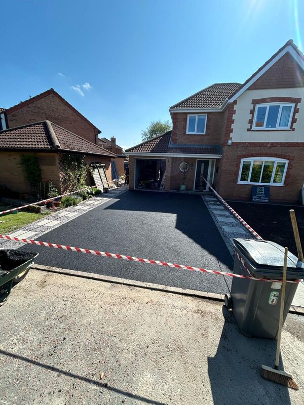 Tarmac driveway being laid at a detached house in Blackpool