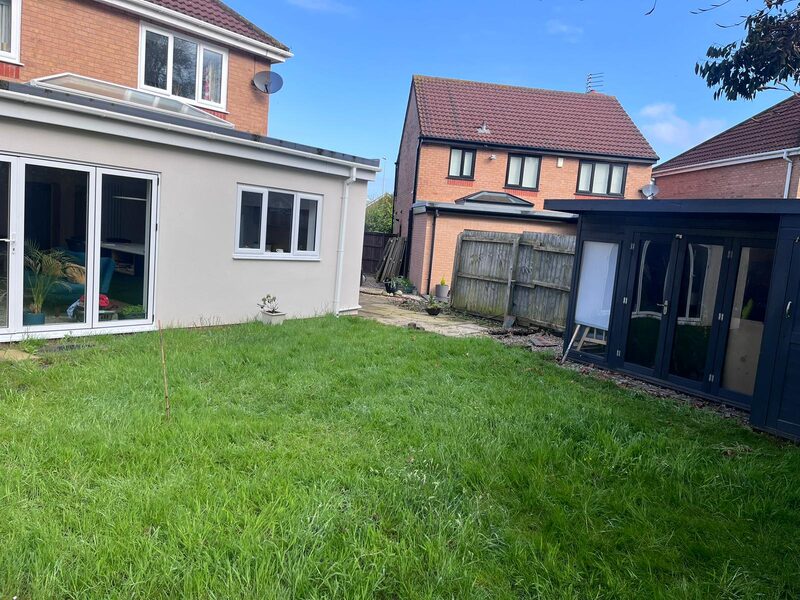 Completed rear house extension with bi-fold doors and rendered walls in Blackpool